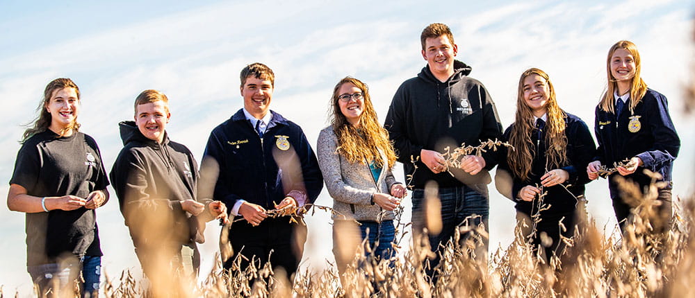 FFA students standing in a field