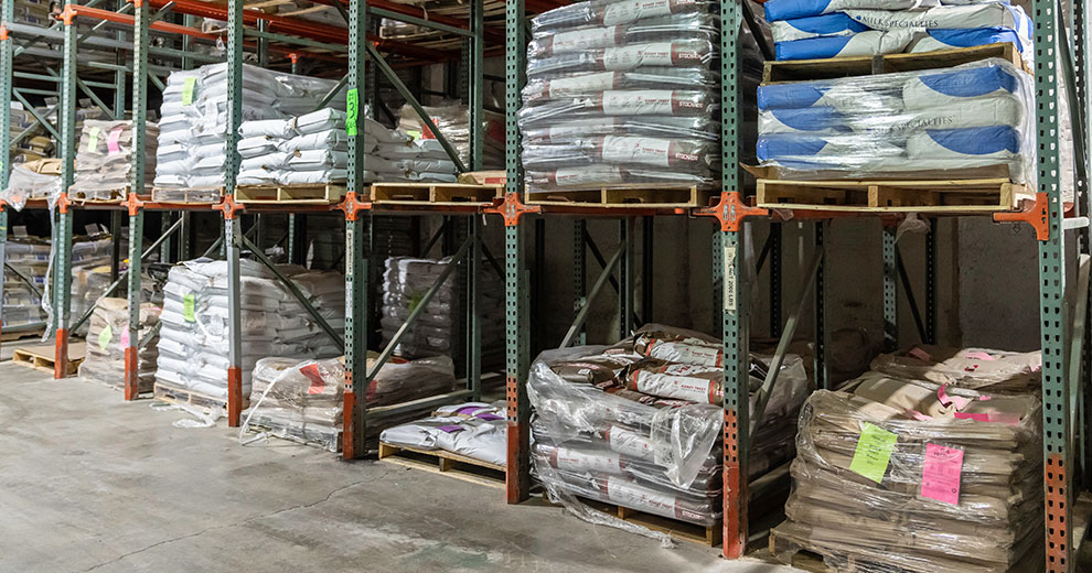 warehouse shelves with Equis feed bags