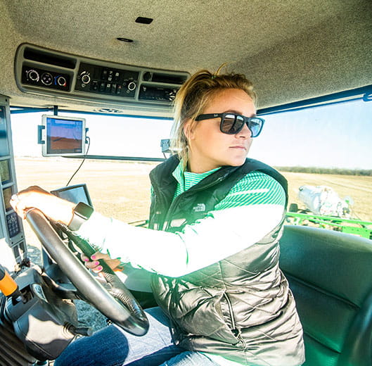 Farmer Taylor Goering in cab of tractor