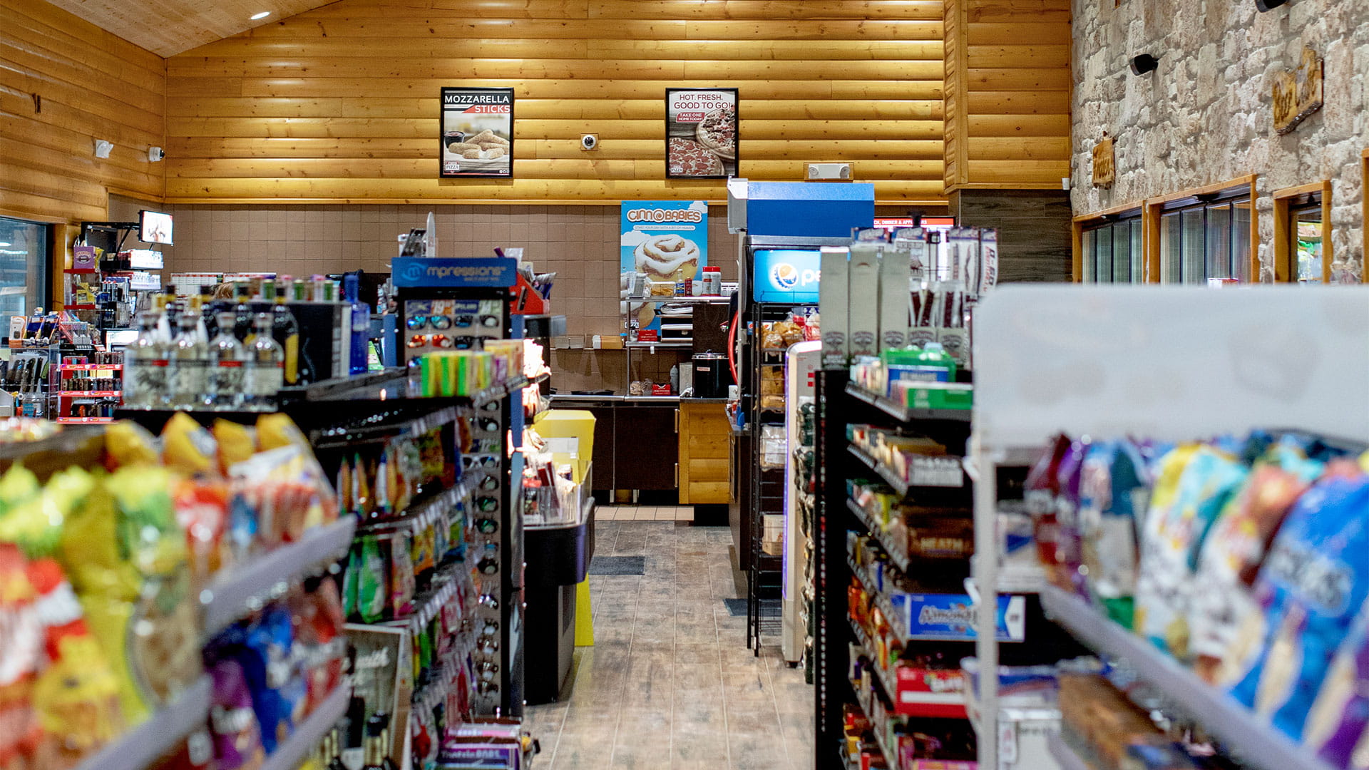 Shelves containing snacks inside of a Cenex store