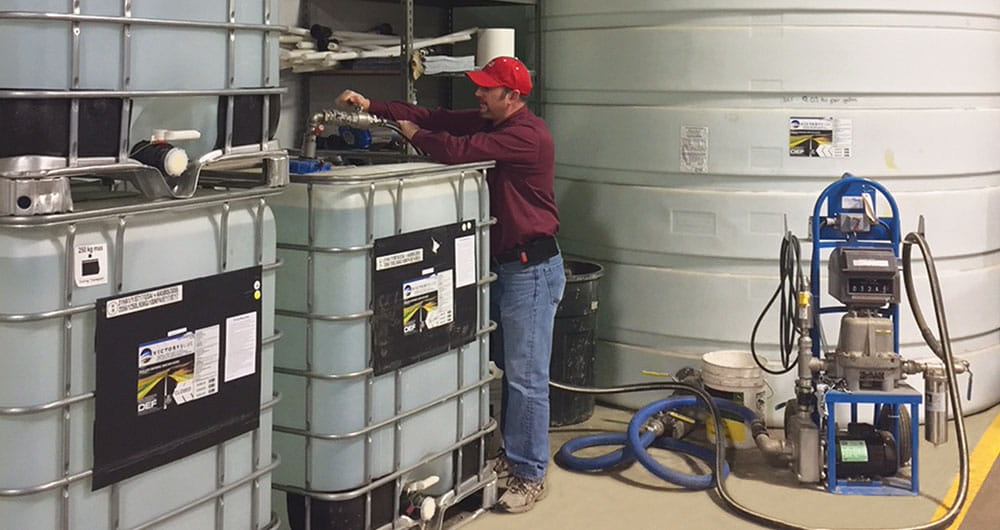 Man servicing propane canisters
