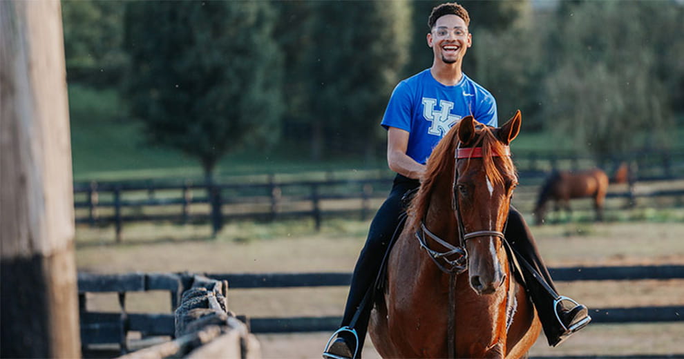 College student riding a horse