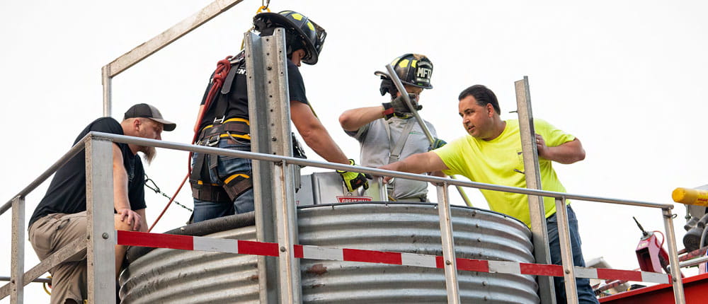 Firefighters and first-responders practice safety protocols at a grain bin.