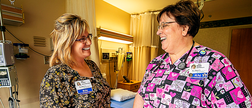 Two nurses in a hospital room