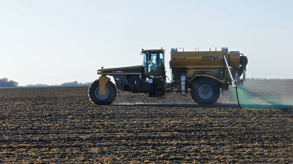 Dry fertilizer spreader in the field